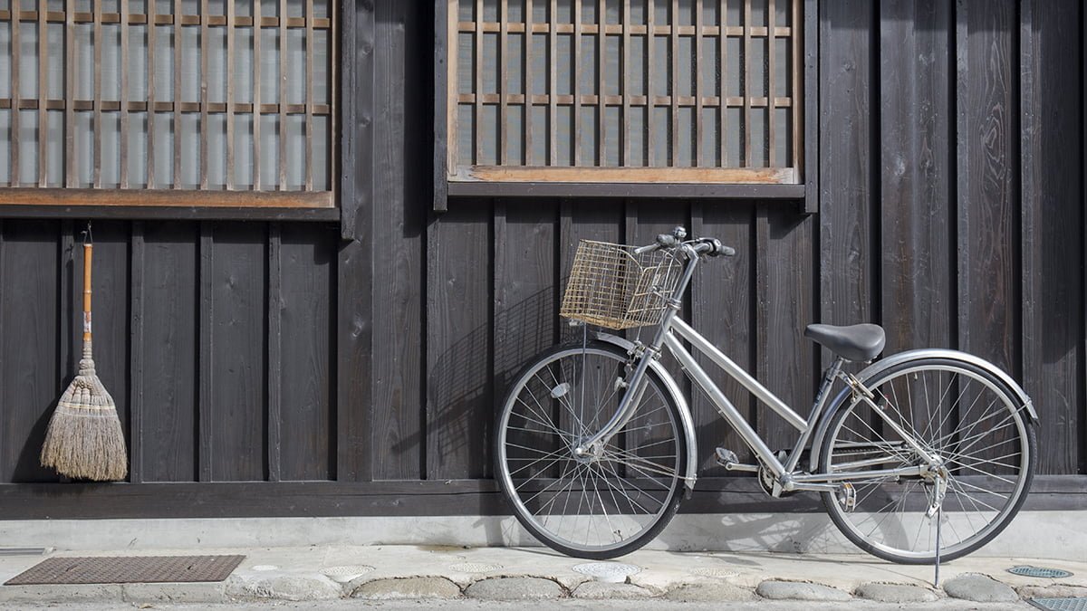 Bicycle and broom in front of old Japan house, Shirakawa go ,Japan